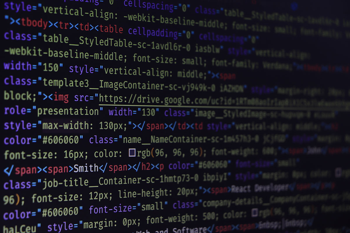 Close-up of syntax-highlighted source code on a dark monitor